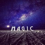 Large white letters spelling “MAGIC” stand on a barren, textured landscape at night under a vivid, star-filled sky with the Milky Way above—an iconic scene among BurningMan photos or what some might call photos impossibles.